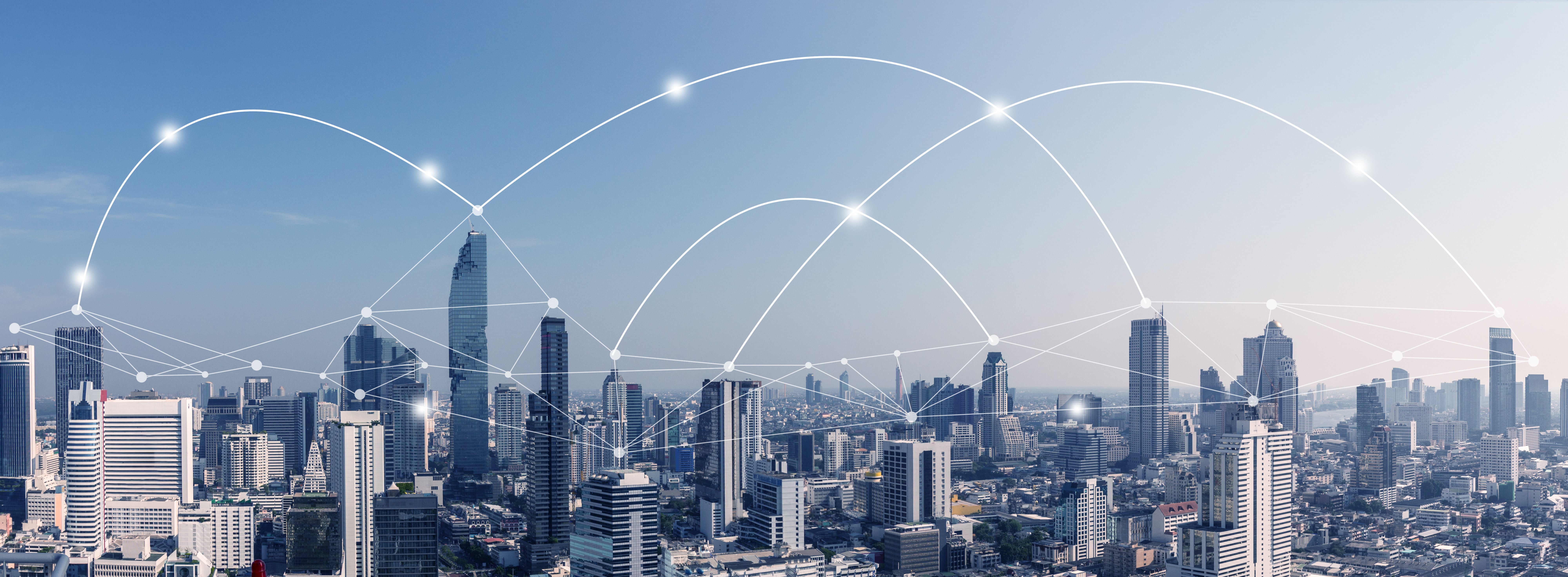 Panoramic city skyline with digital connection lines symbolising global data or blockchain networks