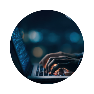 Someone typing on a laptop.