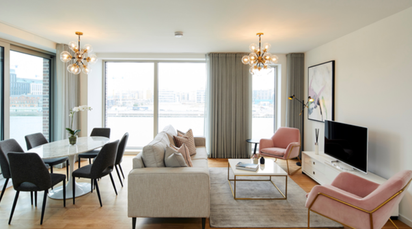 Modern furniture, a dining table, sofa, chairs and tv. With natural lighting and a view of Dublin Canal