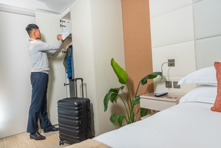 Man unpacking his stuff in an apartment
