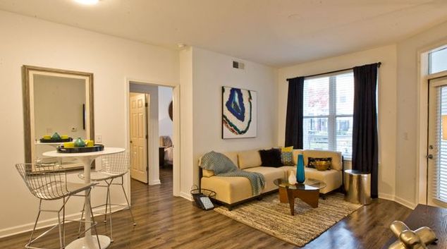 Living room at Exchange at Middle Town Apartment