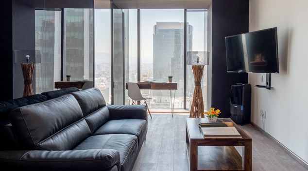 Living room at Magenta Apartment Reforma