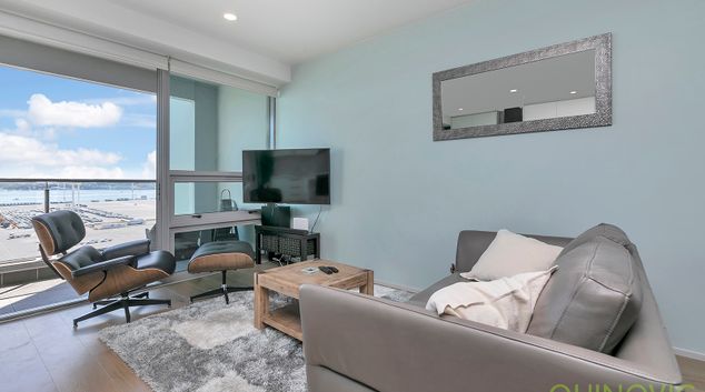 Living room at Beach Road Apartment, Queens Wharf, Auckland