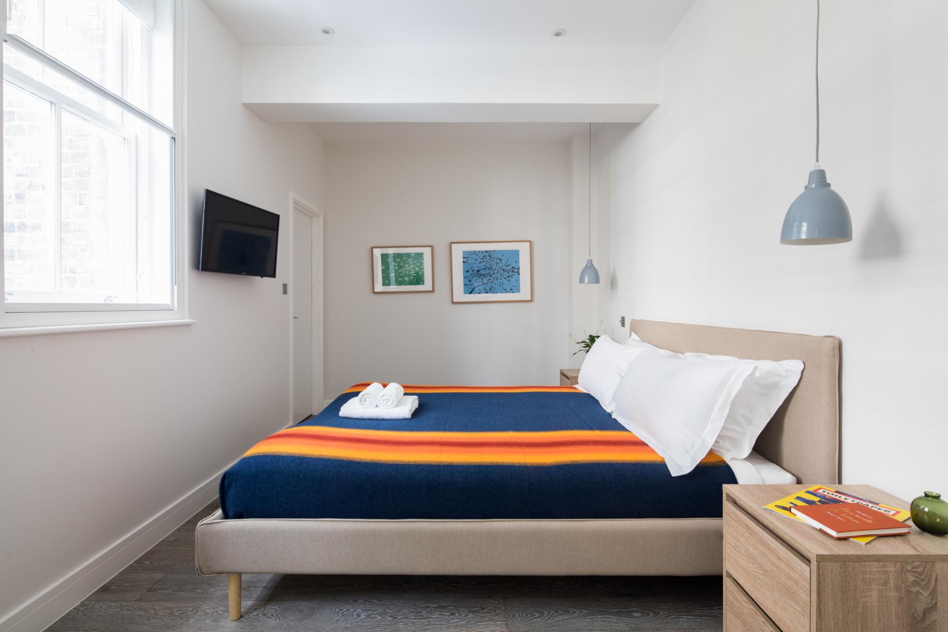 Bedroom at Leicester Square 8a Apartments